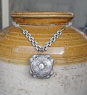 Necklace with antique powder puff pendant and rhinestones