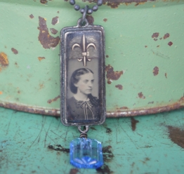 Necklace with tintype photo set in bezel under resin