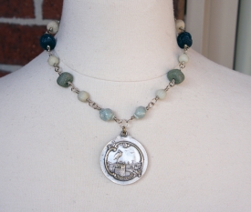 Necklace with an antique mirror locket