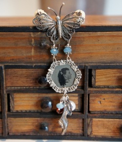 Necklace with picture pendant, a butterfly and a silver shoe