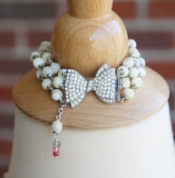 Bracelet made with rhinestone bow clasp and mother of pearl beads