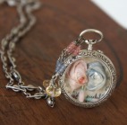 Necklace made with antique silf roses set into an antique silver watch case