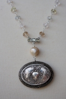 Necklace made with antique powder compact and pearls